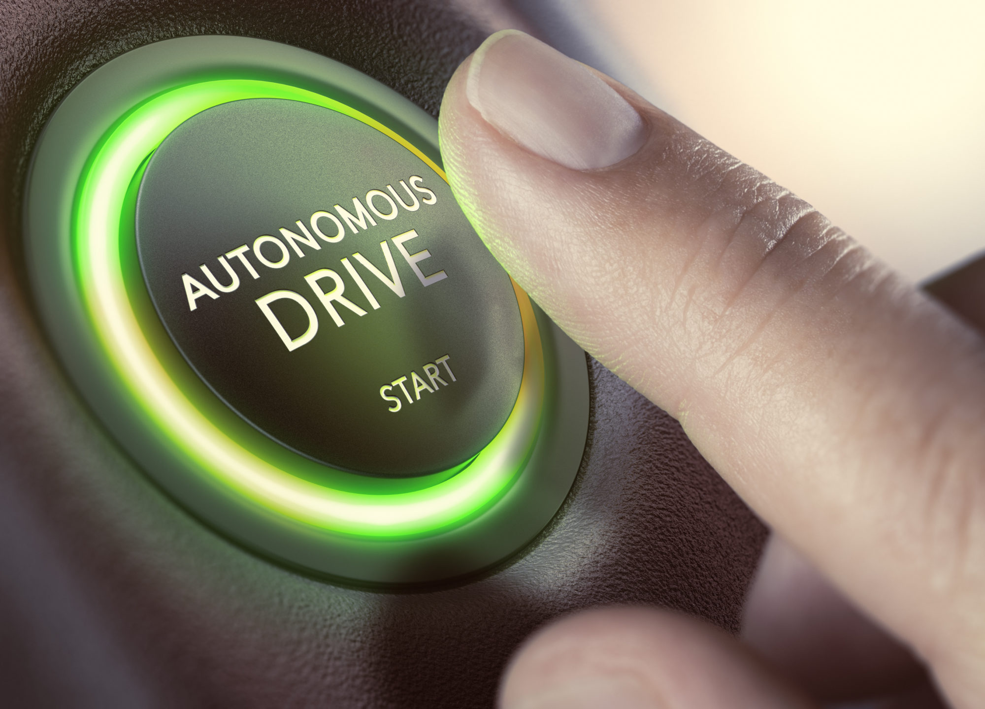 Finger klar til å presse inn knapp som det står "Autonomous drive" på