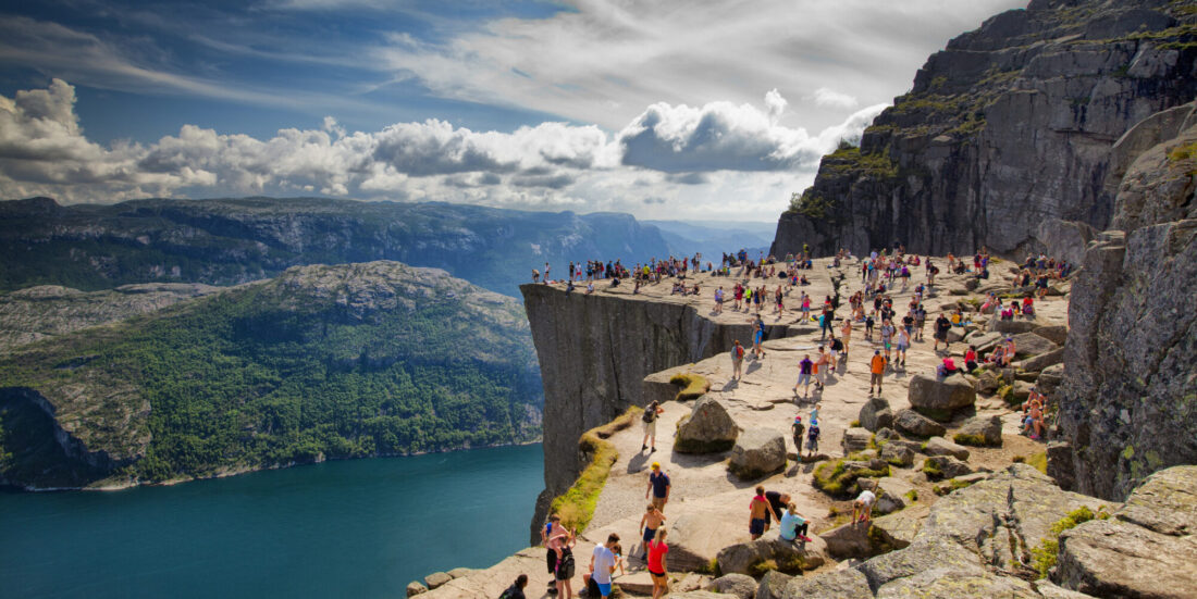 Preikestolen, Norway - July 28, 2014: Pulpit Rock (Preikestolen) is one of the most favourite attractions in Norway. Its a rock 600m above the Lysefjord. During the Summer there are a lot of people there - local people and tourists. Gosiek-B/iStock